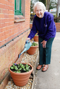 stand pots on a layer of moist gravel