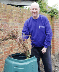 adding materials to a compost bin