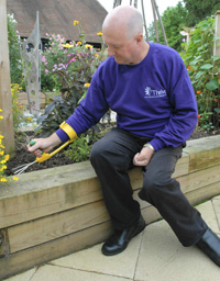 Sitting on the edge of a raised bed