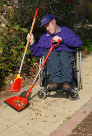 Sweeping with long handled dustpan and brush