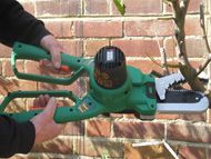 Powered safety pruning saw and lopper