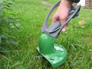 Battery powered grass trimmer